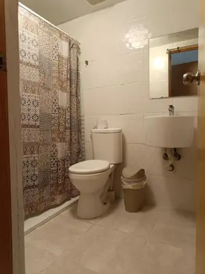 a bathroom with a toilet and a sink at Apartment in Riviera Colonial in Calero