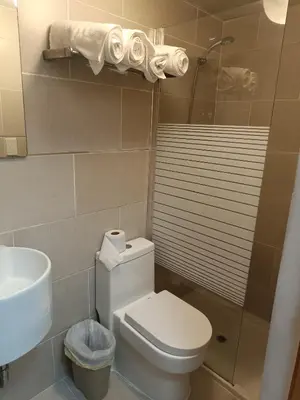 a bathroom with a toilet and a sink and a shower at Apartment in Riviera Colonial in Calero
