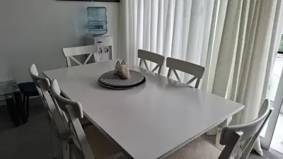 a white table with a hat on top of it at Two-Bedroom Apartment in Santo Domingo in Santo Domingo
