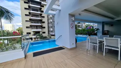 a balcony with a swimming pool in a building at Two-Bedroom Apartment in Santo Domingo in Santo Domingo
