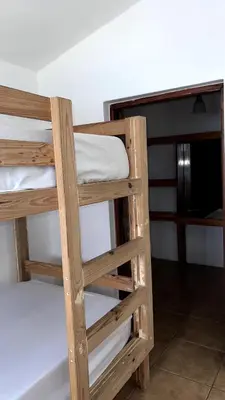 a pair of bunk beds in a room at Front Beach Punta Rucia Villa in Punta Rucia