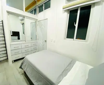 a white bedroom with a bed and a window at Colonial zone 3 bed 3 rooms balcony in Santo Domingo