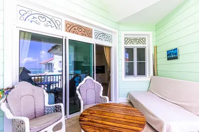 a living room with a couch and a table at Oceanfront Apartment in Cabarete with Pool and Beach Access in Cabarete