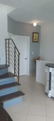 a living room with stairs and a stair case at Apartment mit Meerblick direkt an der Playa Popy in Las Terrenas