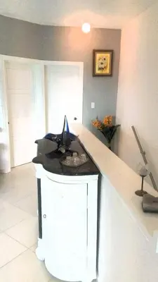 a kitchen with a counter top with a sink at Apartment mit Meerblick direkt an der Playa Popy in Las Terrenas