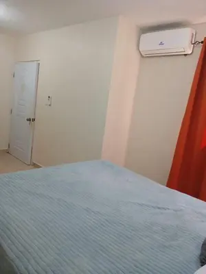 a bedroom with a bed and a window and a door at SDQ Apartment Marbella 4 in La Ureña