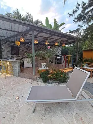 a ping pong table in front of a patio at Villa la casita in Villa Altagracia