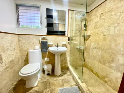 a bathroom with a toilet and a sink and a shower at Fantástico Lugar en el Centro de los Corales RD in Punta Cana