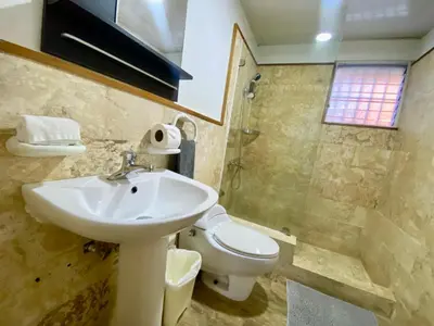 a bathroom with a sink and a toilet at Fantástico Lugar en el Centro de los Corales RD in Punta Cana