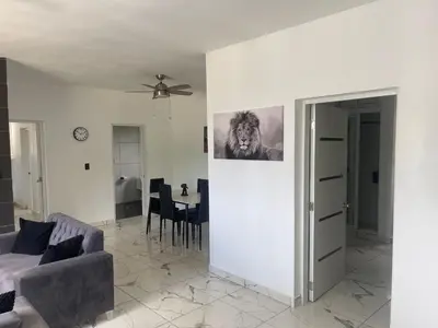 a living room with a couch and a table at Level Suites 3 Premium Suite in Sosúa