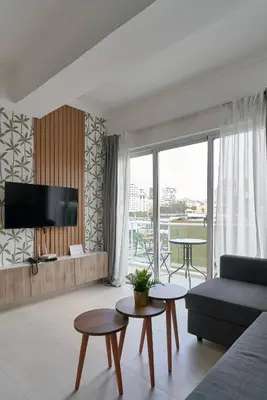 a living room with a couch and a table at Gorgeous Banana Places QDA-IV in Santo Domingo