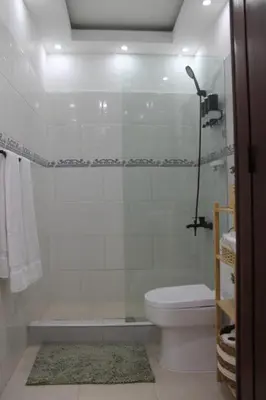 a bathroom with a tub and a toilet and a shower at Cozy Apt with Puerto Plata view in San Felipe de Puerto Plata