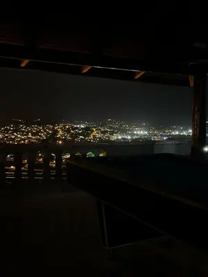 a view of a city at night at Cozy Apt with Puerto Plata view in San Felipe de Puerto Plata
