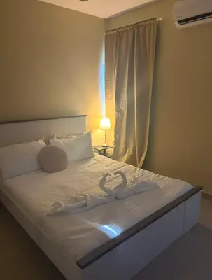 a bed with two swans made out of towels at Villa Atlantica Punta Cana in Punta Cana