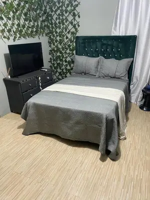 a bedroom with a bed and a television in it at Habitación a 15min del aeropuerto in La Caleta