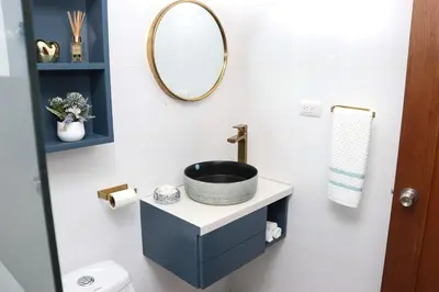 a bathroom with a sink and a mirror at Lux 3BR Oasis With Gazebo & Pool in Pontezuela Arriba
