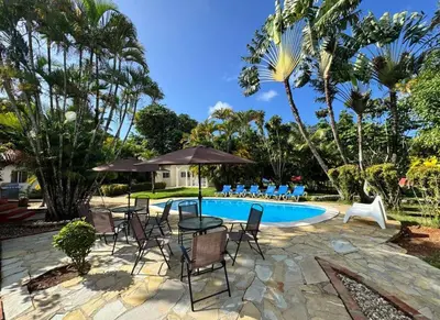 a patio with chairs and a swimming pool at Villa Olga in Sosúa