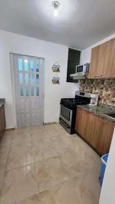 a kitchen with a stove and a counter top at vista hermosa in Cabrera