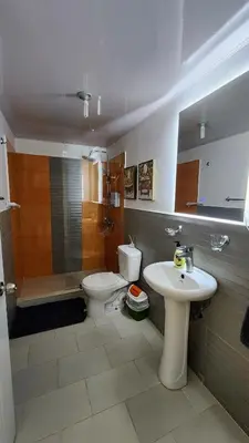 a bathroom with a sink and a toilet and a shower at vista hermosa in Cabrera