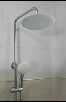 a shower with a shower head and a stool at Exclusive Luxury Apartment with Pool in Santiago de los Caballeros