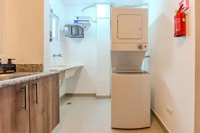 a kitchen with a refrigerator and a sink at Oasis cerca del mar #2 in Monte Adentro
