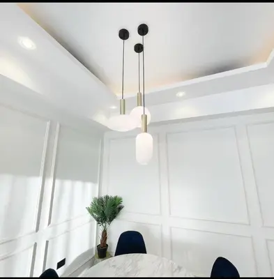 a dining room with a table and blue chairs at Apartamento boca chica in Andrés
