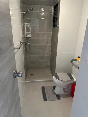 a bathroom with a shower and a toilet at habitat 1 t4 101 ciudad juan Bosch in San Isidro