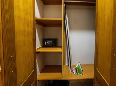 a closet with a door open with a refrigerator at Modern 6 Br Villa With Hot Tub in Sosúa