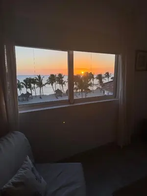 a room with a window with a view of the beach at Cadaques Bayahibe Beach Front in Bayahibe
