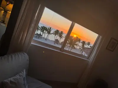 a room with a window with a view of the beach at Cadaques Bayahibe Beach Front in Bayahibe