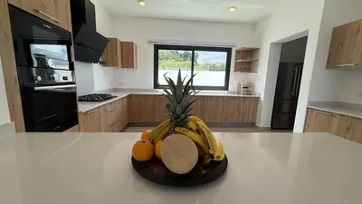 a bowl of fruit on a counter in a kitchen at Oceanview Villa With King Beds in Las Terrenas
