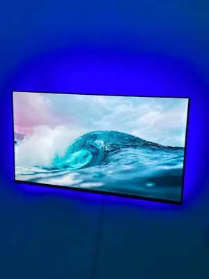 a television screen with a wave in the ocean at Apartmento Xbox WFI TV65 PC Love Relax Work in La Cana