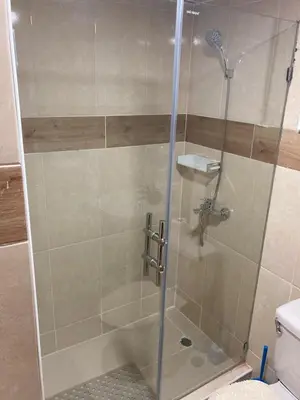 a shower with a glass door in a bathroom at Apartmento Xbox WFI TV65 PC Love Relax Work in La Cana