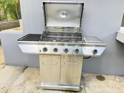 a barbecue grill sitting on the side of a building at villa el naciente in La Cuaba