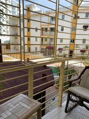 a balcony with a bench and a view of a building at Brisa de mar BOCA CHICA, in Boca Chica