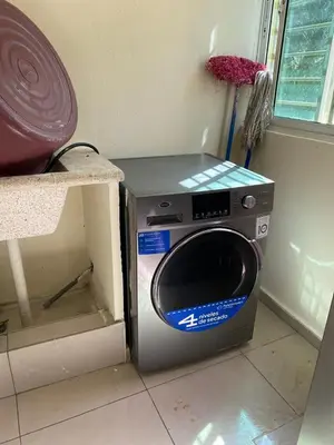 a washing machine sitting on the floor in a room at Brisa de mar BOCA CHICA, in Boca Chica