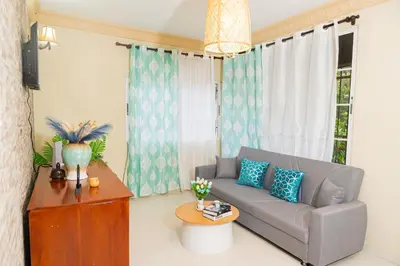 a living room with a couch and a table at Rancho Juliana in Villas del Mar