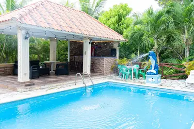 a house with a swimming pool and a gazebo at Rancho Juliana in Villas del Mar
