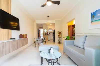 a living room with a couch and a table at Beach Escape -Pool Patio -Free Parking -Pets in Villas del Mar