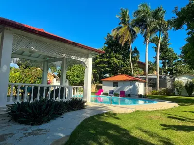 a house with a swimming pool in a yard at Mango house bliss in Las Galeras
