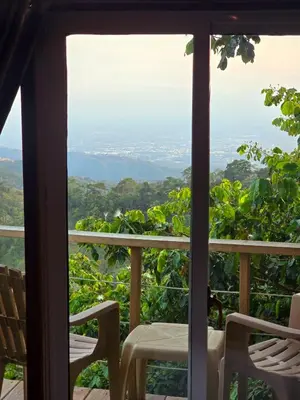 a view from the window of a room with a table and chairs at Pure Nature - Eco-lodge in the Mountains! in La Búcara