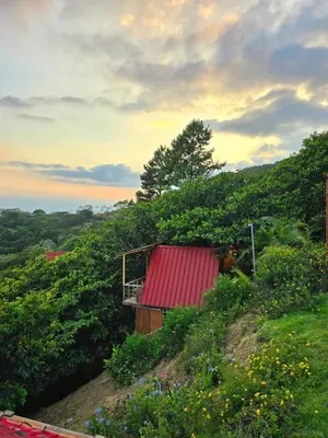 a small house with a red roof on a hill at Pure Nature - Eco-lodge in the Mountains! in La Búcara