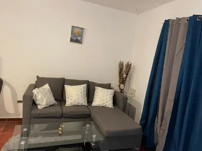 a living room with a couch and a coffee table at Kasita del sol boca chica in Boca Chica