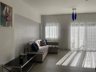 a living room with a couch and a table at Luxury sea Cadaques Caribe in Bayahibe