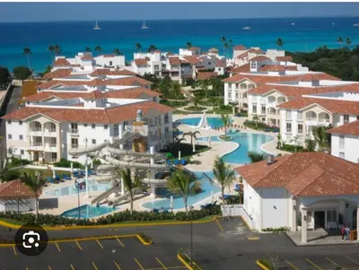 an aerial view of a resort with a pool at Luxury sea Cadaques Caribe in Bayahibe