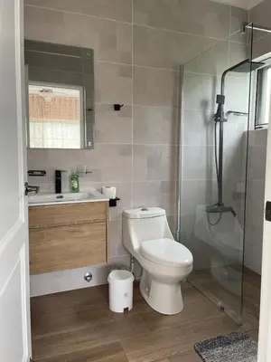 a bathroom with a toilet and a sink and a shower at Luxury sea Cadaques Caribe in Bayahibe