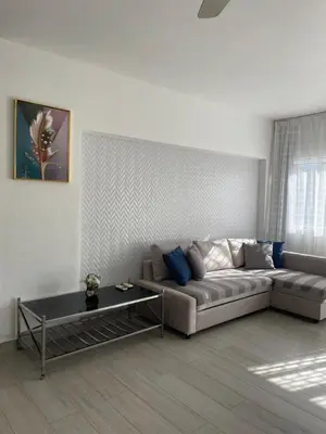a living room with a couch and a table at Luxury sea Cadaques Caribe in Bayahibe