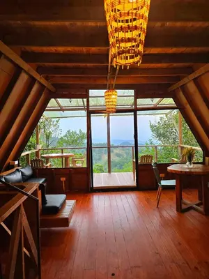 a large room with a large window and a table and chairs at Natural Refuge! - Cabin at the top of the mountain in La Búcara