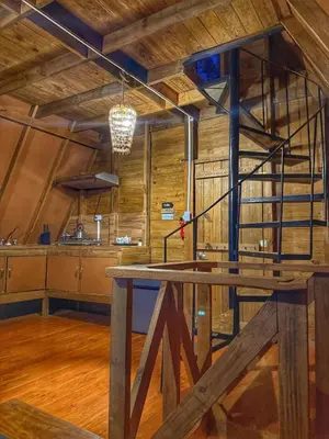 a kitchen with a wooden table in a room at Natural Refuge! - Cabin at the top of the mountain in La Búcara
