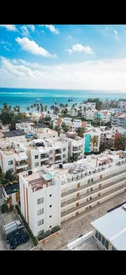 an aerial view of a city with buildings and the ocean at Apartamento en punta cana close to the beach in Punta Cana